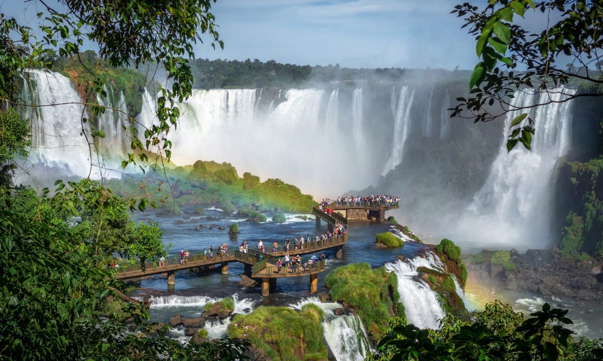 Tourists exploring Iguazu Falls on the border of Brazil and Argentina.