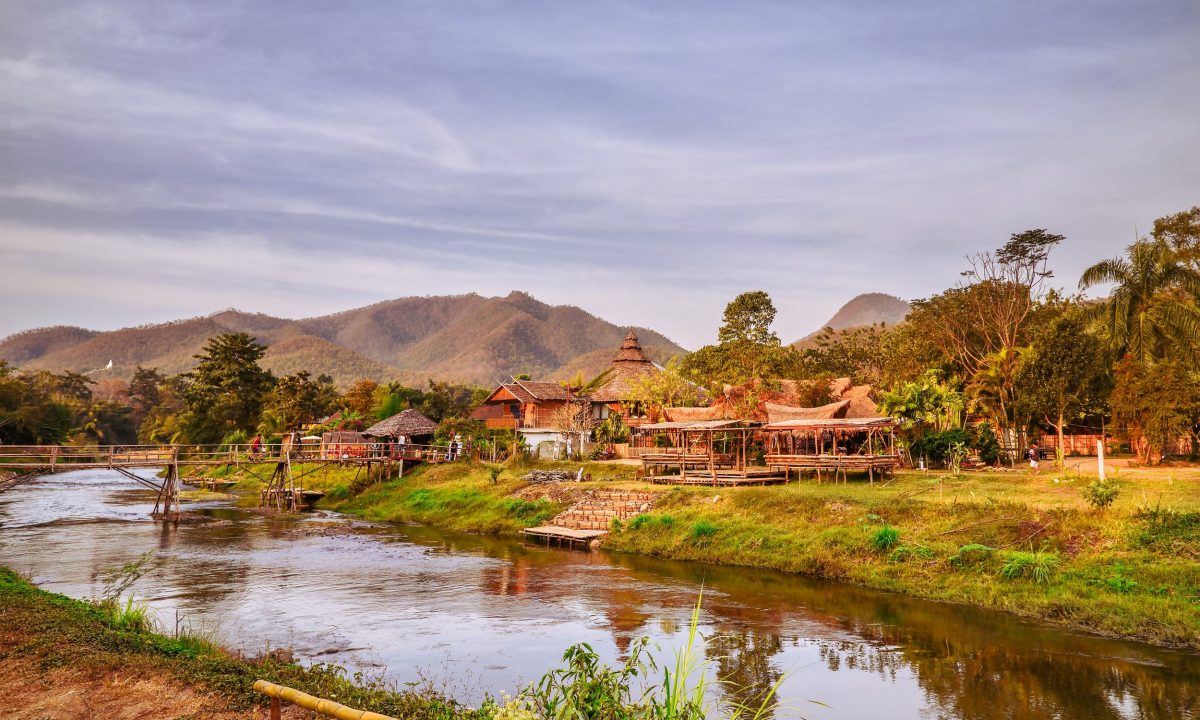 The shore of the river Pai. View of the village and mountains, Northern Thailand